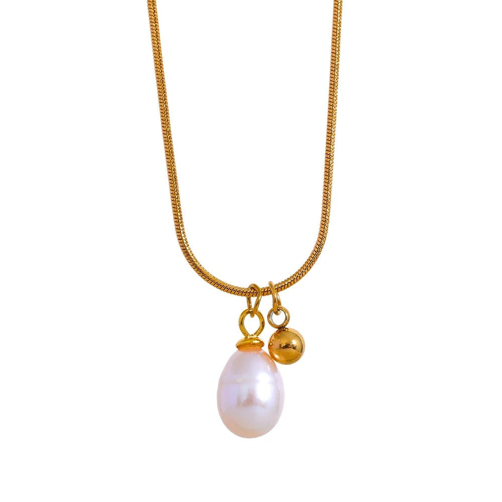 Gold-tone snake chain necklace with an oval pearl drop and a small gold bead charm