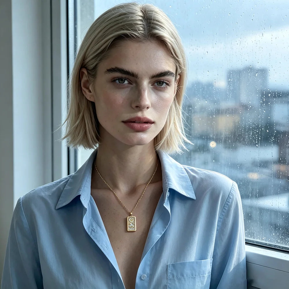 Woman wearing a gold tarot card pendant necklace