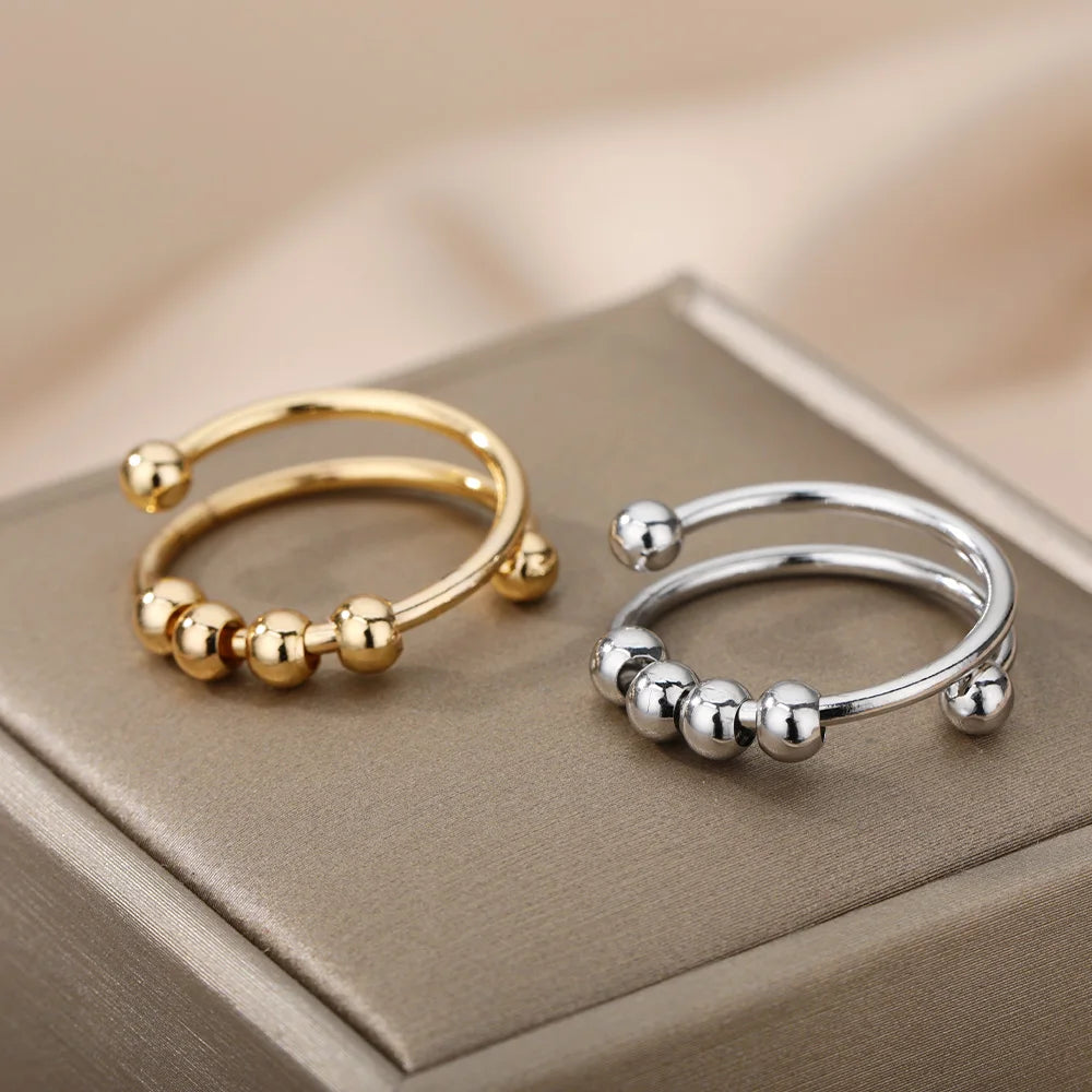 Gold and silver adjustable spinner rings with beads