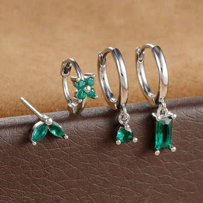 Silver-tone four-piece ear stack with green stones: leaf stud, flower huggie, round drop hoop and baguette drop hoop