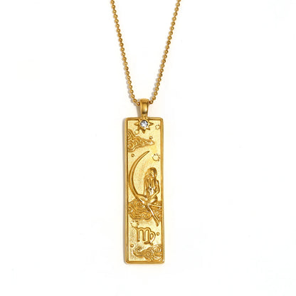 Gold-tone Virgo zodiac bar pendant necklace with engraved maiden and moon, and a small clear stone, on white