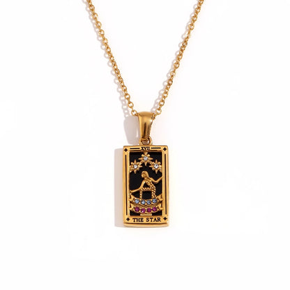 Gold-tone The Star tarot card pendant necklace with black enamel, clear and pink stones, on white