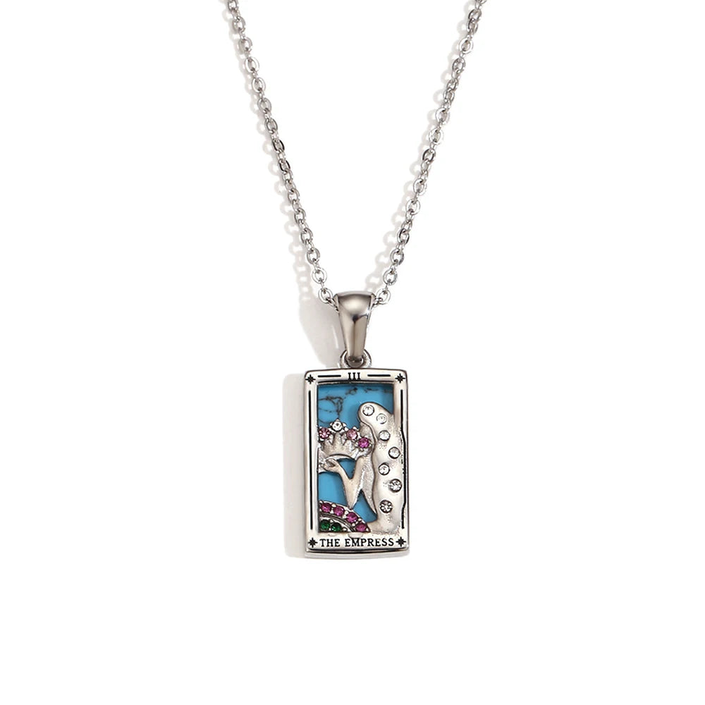 Silver-tone The Empress tarot card pendant necklace with blue enamel and pink stones, on white