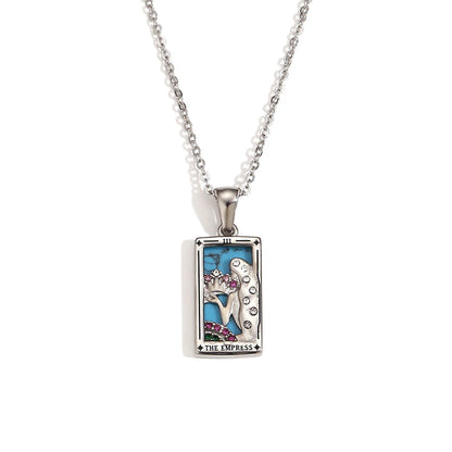Silver-tone The Empress tarot card pendant necklace with blue enamel and pink stones, on white
