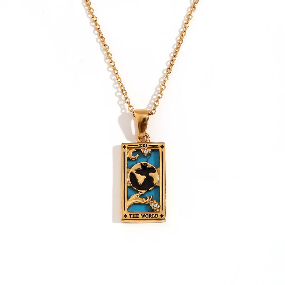 Gold-tone The World tarot card pendant necklace with blue and black enamel, on white