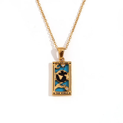 Gold-tone The World tarot card pendant necklace with blue and black enamel, on white