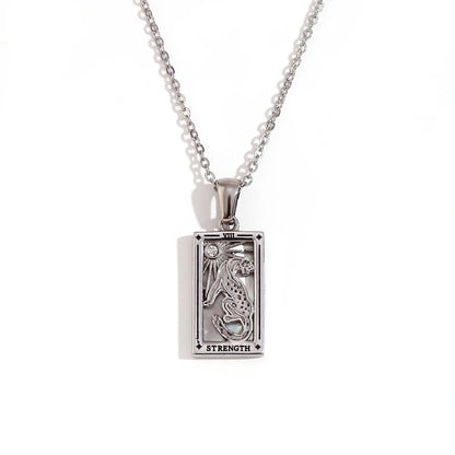 Silver-tone Strength tarot card pendant necklace with cut-out lion design and a small clear stone, on white