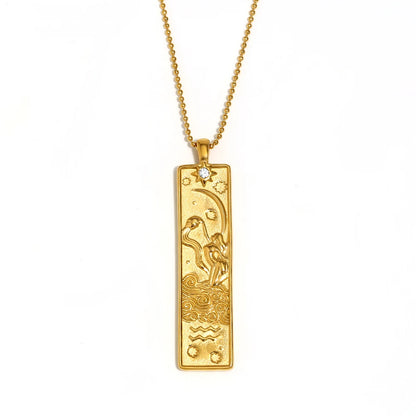 Gold-tone Aquarius zodiac bar pendant necklace with engraved water bearer and a small clear stone, on white